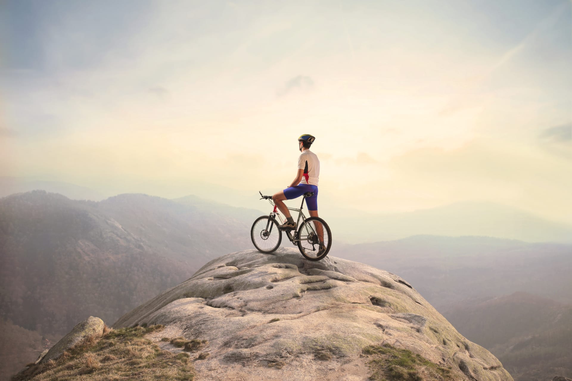 adventure biking on mountain top to boost well-being